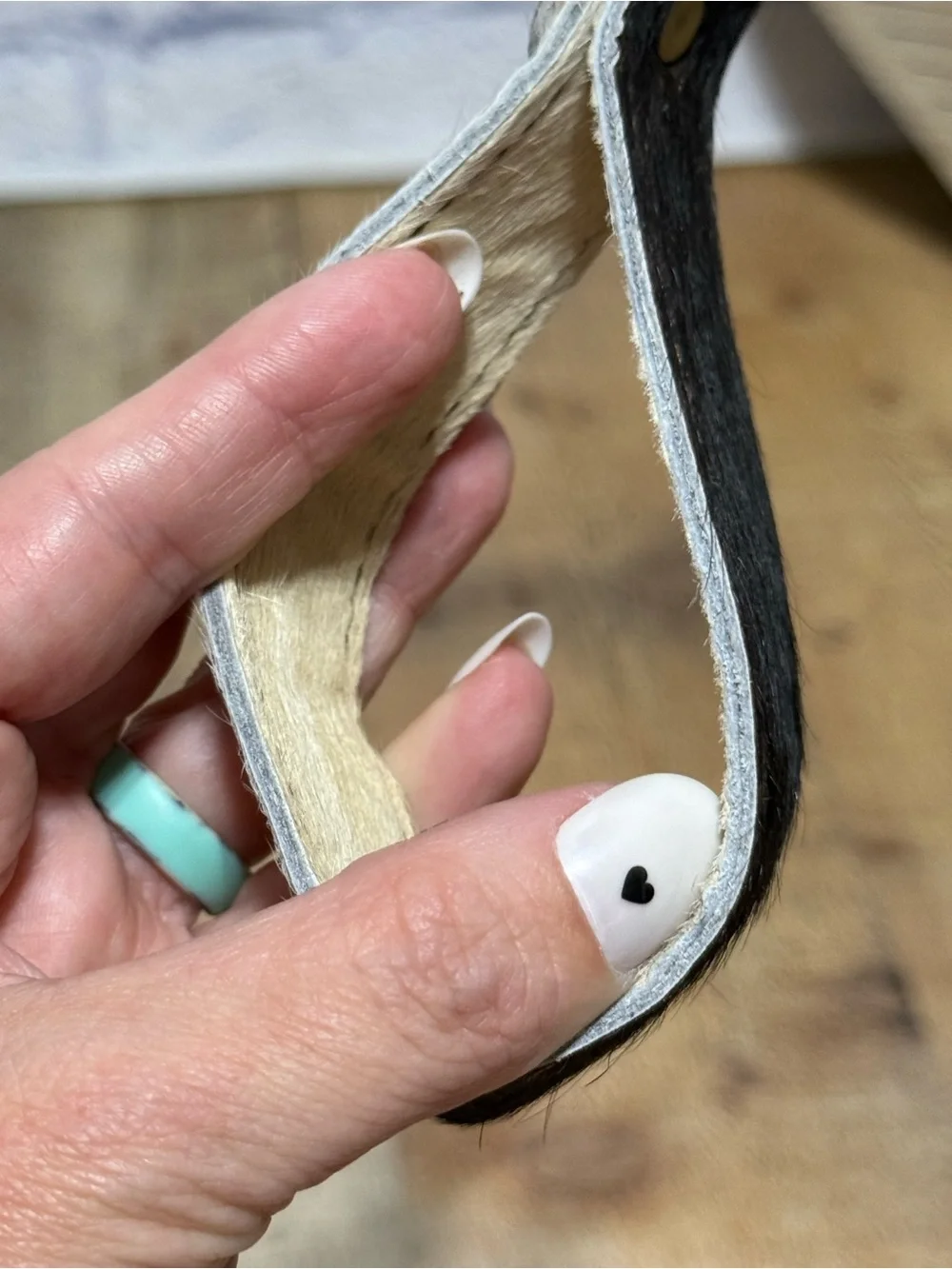 keychain hair-on-hide cowhide strap paired with a brass hook